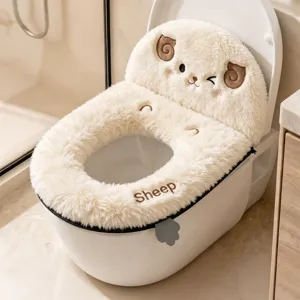Sheep-shaped fluffy cover with embroidered face, lettering and visible zip edge on a toilet