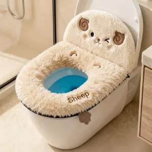 Fluffy cream fabric and embroidered sheep face on a padded toilet seat cover in a home bathroom
