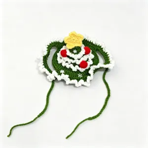 Crocheted Christmas tree pet hat in green with a yellow star, red accents and tie strings