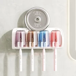 Wall-mounted toothbrush holder set with four colored cups and four electric toothbrushes