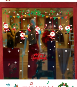 Festive Christmas window decals featuring Santa, snowman, and snowflakes on glass