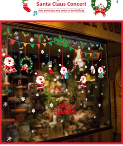 Detail view of festive Christmas window stickers with Santa musicians and snowflakes