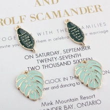 Detail of leaf-shaped alloy charms with Plant Lady text on a stylish backdrop