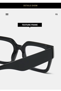 Detailed close-up of thick black glossy frames and wide temples on square glasses