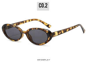 Detailed 45-degree view of tortoise shell vintage oval sunglasses with grey lenses