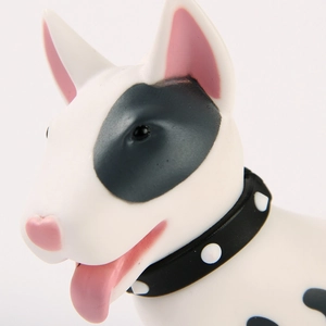 Close-up of Bull Terrier figurine with black eye patch and studded collar detail