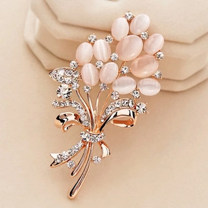 Elegant rose gold flower brooch with pink cat eye stones and sparkling rhinestones