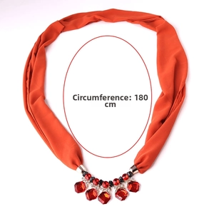 Detail showing orange chiffon scarf necklace with red gem charms and 180cm circumference