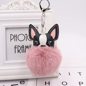 Cute French Bulldog PU leather keychain with a large pink pom pom on white background