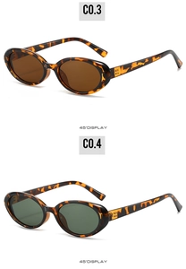 Detail of retro oval tortoiseshell sunglasses with golden B hardware in a 45-degree view