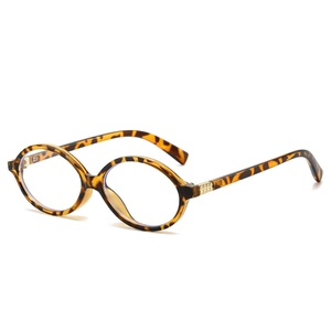Retro tortoise shell oval sunglasses with vintage gold stud details on white background