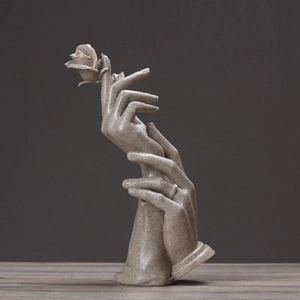 Artistic hand sculpture holding rose for modern minimalist home decor ornament