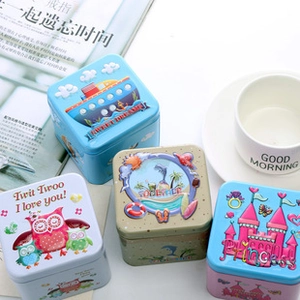 Detailed 3D embossed square tin boxes with cartoon themes like ships and owls