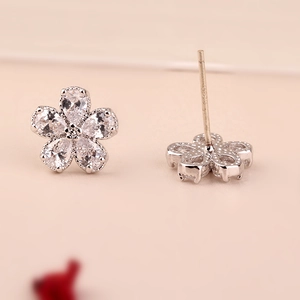 Macro shot of S925 sterling silver flower earrings with sparkling cubic zirconia stones