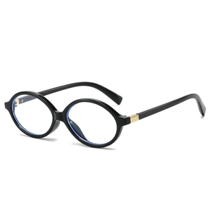 Oval black frame sunglasses with golden rivets and blue light filtering clear lenses
