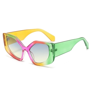 Polygonal cat-eye sunglasses with rainbow gradient frames and blue-yellow tinted lenses