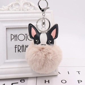 Close-up of French bulldog pompom keychain in multiple colors with silver metal hook