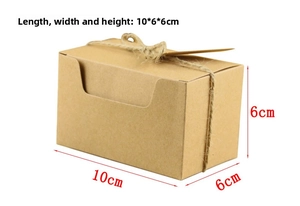 Detail view of 10x6x6cm kraft paper gift box with twine rope and small hanging tag