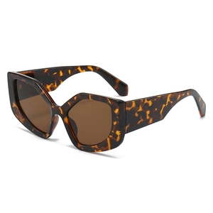Chic cat-eye hexagonal sunglasses with tortoiseshell frame and dark brown lenses