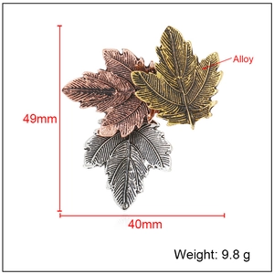 Vintage maple leaf brooch in three-tone alloy finish with dimensions 49mm by 40mm