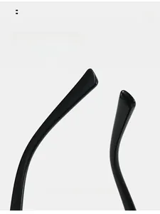 Detail view of smooth integrated nose pads on black oval sunglasses for comfort