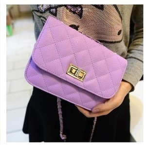 Mini purple quilted crossbody bag with gold chain strap and turn-lock closure