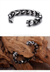 Close-up of punk style skull bracelet with black braided cord and steel skull charm