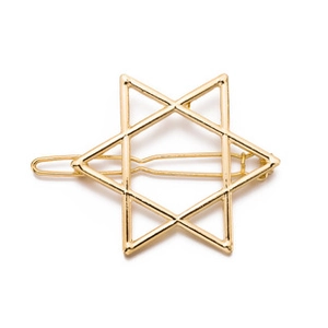 Detail of a gold metallic hair clip featuring a geometric hollow hexagram star design