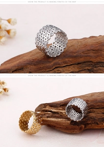 Detailed view of hollow lace rings with 18K gold plating and sparkling zircon stones