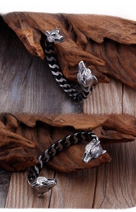 Detail of dragon head bracelet with black leather rope and vintage steel finish