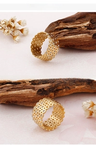 Macro shot of 18K gold plated honeycomb ring with tiny diamonds and wavy edges