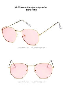 Detail view of gold metal hexagonal sunglasses with transparent pink lenses on white background