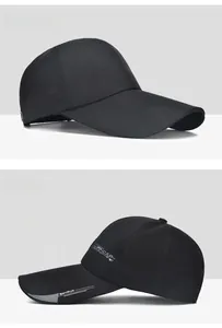 Detail view of black sports baseball cap with silver Sports Cap 87 printed text