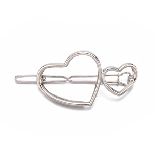 Detail shot of silver metal hair clip with a minimalist double hollow heart design