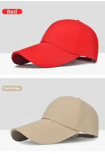 Close-up of red and dark beige cotton baseball caps showing textures and adjustable strap