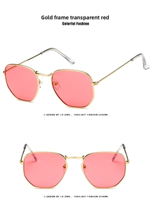 Detail of gold metal frame sunglasses with transparent red geometric lenses