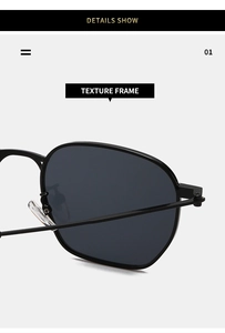 Close-up of the black textured frame and hinges on retro square metal sunglasses