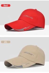 Detail view of red and beige baseball caps with SportStyle lettering and adjustable strap