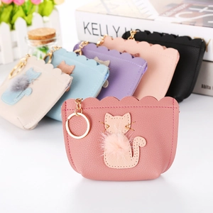Detail of cute cat pattern coin purses in multiple colors with golden keychains