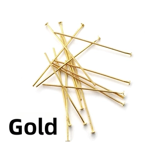 Detailed view of bulk golden metal flat head pins for DIY jewelry making accessories