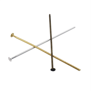 Detailed view of flat head T-pins in gold, silver, and bronze for jewelry making