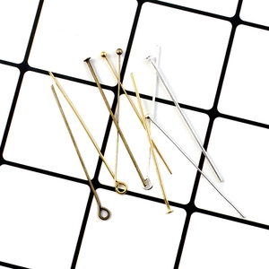 Assorted gold and silver metal eye pins and T-pins for DIY jewelry making and beading