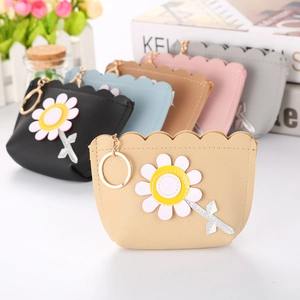 Detail of colorful PU leather coin purses with daisy flower patterns and metal keychains