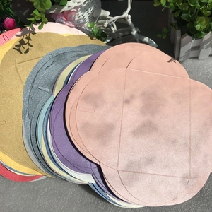Detailed close-up of colorful pearlescent heart clasp envelopes in various shimmer shades