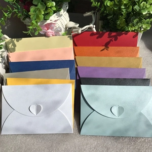 Premium pearlescent envelopes with heart-shaped clasps in various vibrant colors