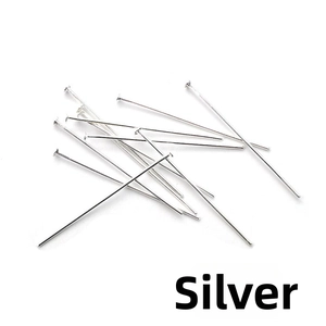 Macro view of silver flat head pins and T-pins for DIY jewelry making and beading