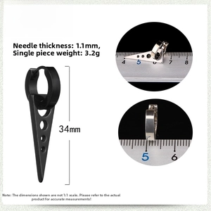 Macro detail of black punk triangle earrings with 1.1mm needle and 34mm length specs