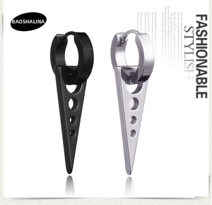 Macro view of punk style black and silver stainless steel hollow triangle drop earrings