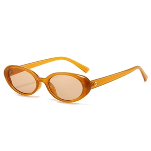 Retro small oval sunglasses in amber finish with UV protection and 90s aesthetic