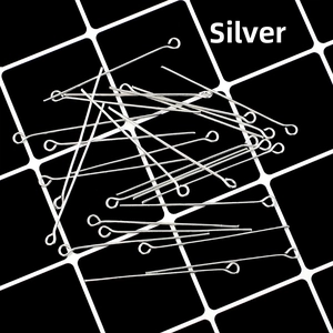 Macro shot of silver eye pins for DIY jewelry making displayed on a black grid